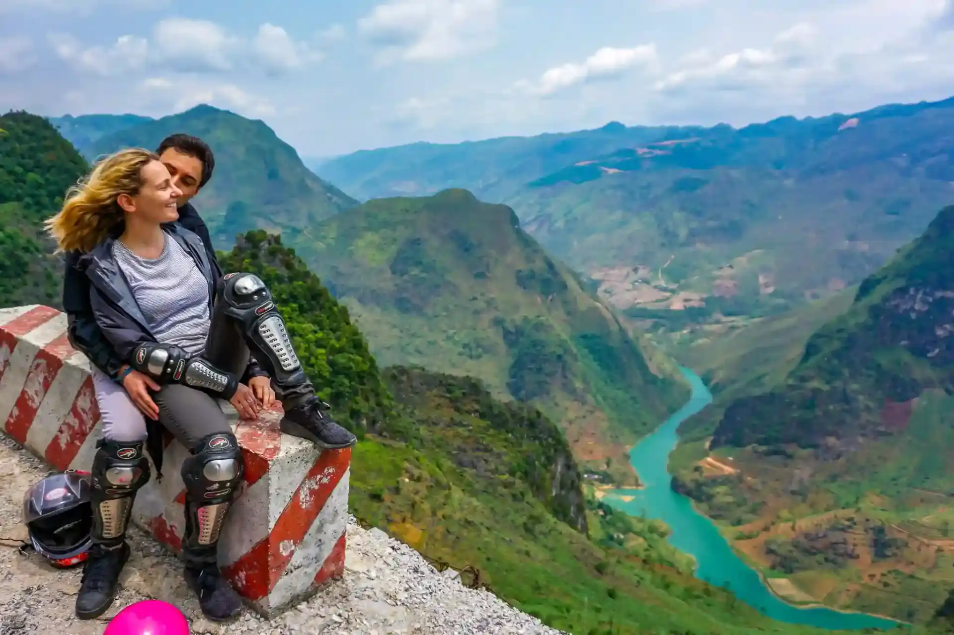 Couple overlooking the Nho Que River canyon from Ma Pi Leng Pass, Ha Giang